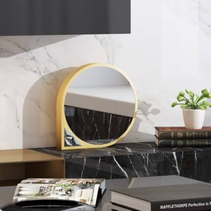 Unique tabletop mirror with asymmetrical frame and prism artwork in a stylish dressing room.