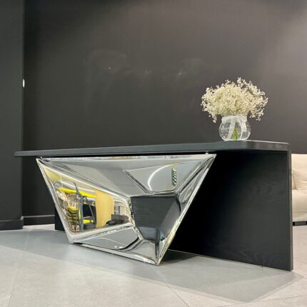 Polished stainless steel console table with sculptural base