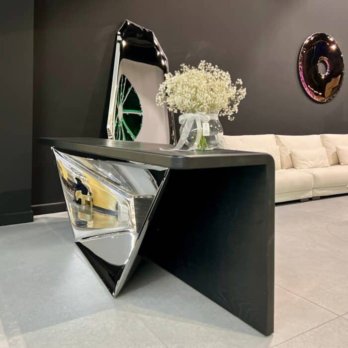 Polished stainless steel console table with sculptural base