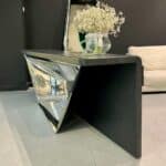 Sculptural console table in stainless steel and wood