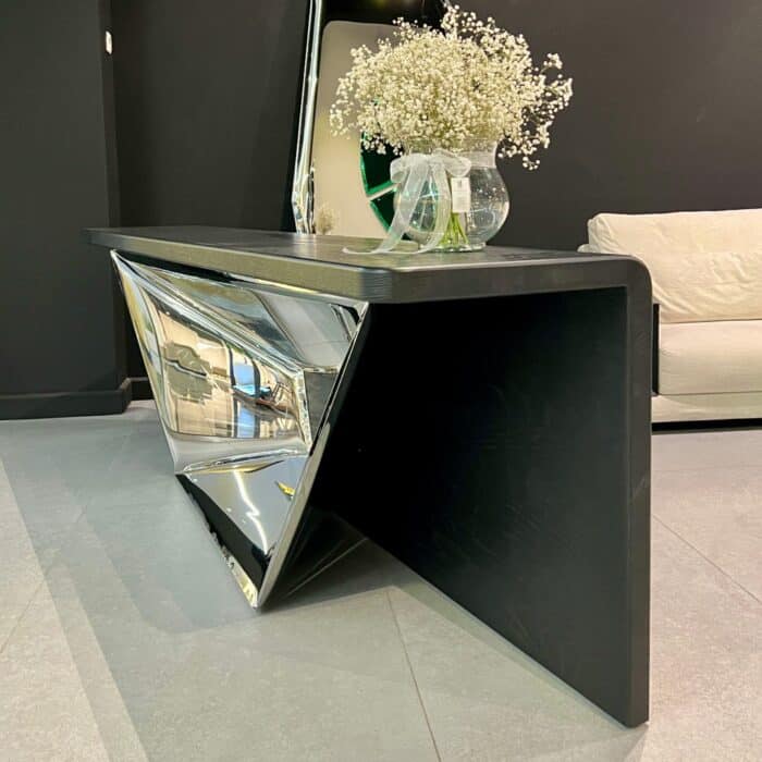 Sculptural console table in stainless steel and wood