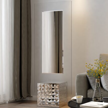 Free-standing full-length mirror with a beveled-edge glass panel, supported by a square cube base adorned with 3D prism-shaped mirrored artwork, perfect for contemporary interiors.