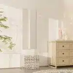 Free-standing full-length mirror with a beveled-edge glass panel, supported by a square cube base adorned with 3D prism-shaped mirrored artwork, perfect for contemporary interiors.