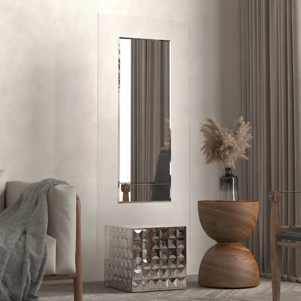 Free-standing full-length mirror with a beveled-edge glass panel, supported by a square cube base adorned with 3D prism-shaped mirrored artwork, perfect for contemporary interiors.