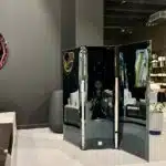 Curved, reflective folding panels for luxury interiors