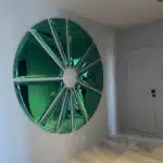 Handmade sunburst wall art in stainless steel