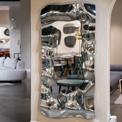 A luxury silver-tinted wavy mirror, perfect for modern interiors