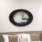1. Black tinted glass luxury wall mirror with textured surface