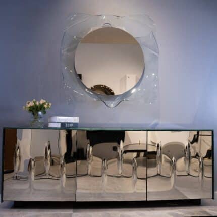 Luxury silver fused glass console table with mirrored top and storage shelves