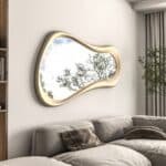 Freeform water droplet wall mirror in semi-matt gold finish