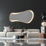 Freeform water droplet wall mirror in semi-matt gold finish