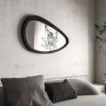 Freeform organic wall mirror with ebony wood frame