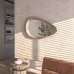 Freeform pebble mirror with semi-matt gold frame