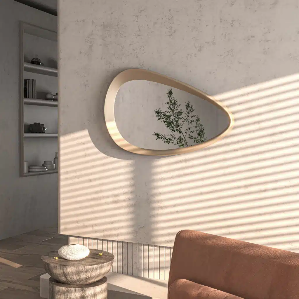 Freeform pebble mirror with semi-matt gold frame