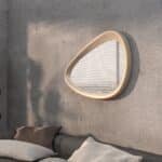 Freeform pebble mirror with semi-matt gold frame