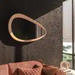Freeform pebble mirror with semi-matt gold frame