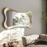 • Designer sculptural mirror in Semi-Matt Gold