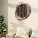 Sculptural pebble mirror in Antique Oak