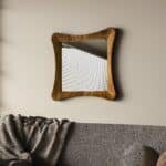 Handmade sculptural wall mirror in walnut finish