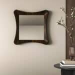 Handmade sculptural wall mirror in ebony finish