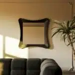 Handmade sculptural wall mirror in matt black paint