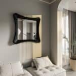 Handmade sculptural wall mirror in matt black paint